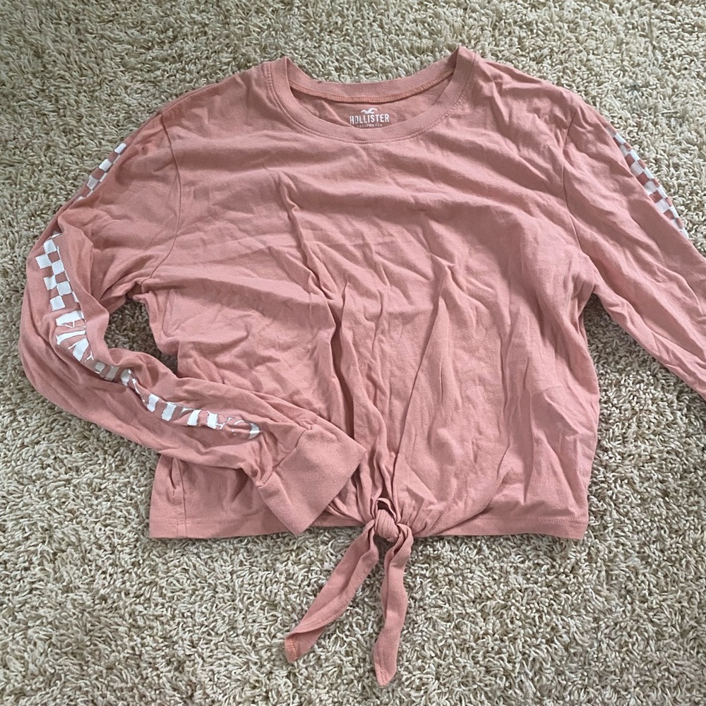 Hollister coral pink long sleeve with checkerboard in white on side with logo